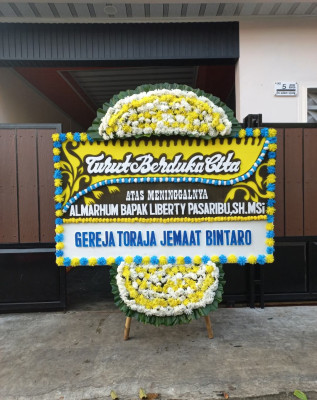 Papan Bunga Duka di Bangun